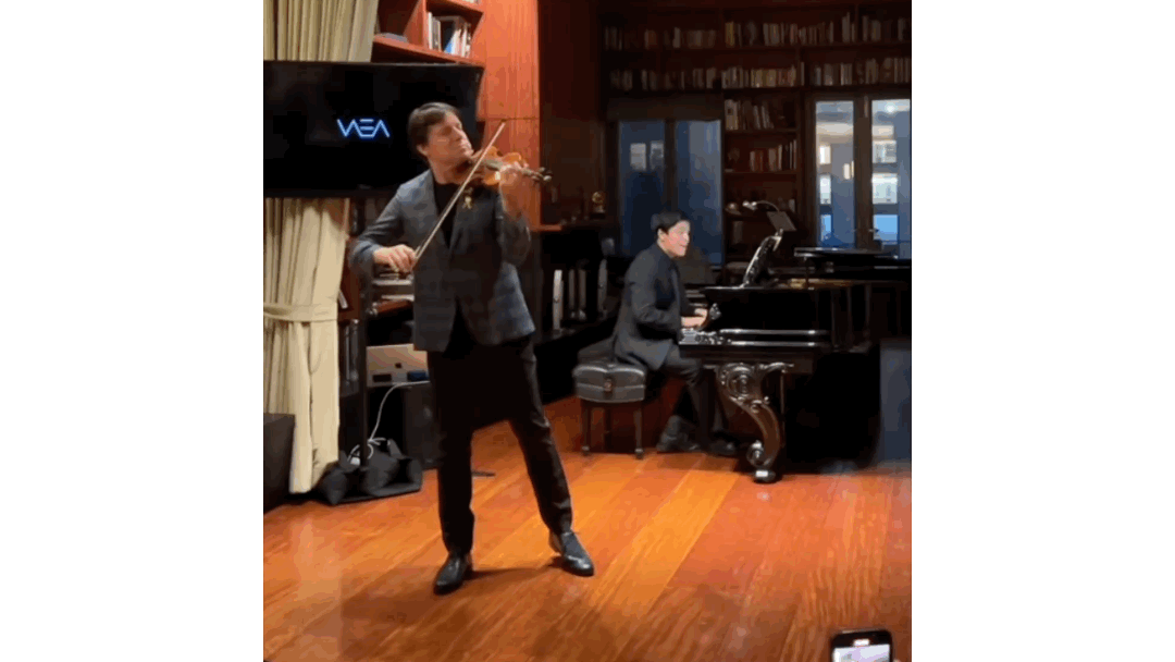 Giancarlo Llerena Performing With Joshua Bell